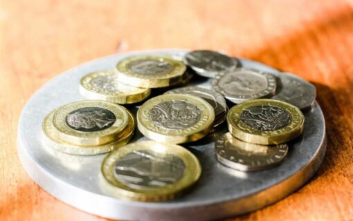 a pile of £1 coins on a plate